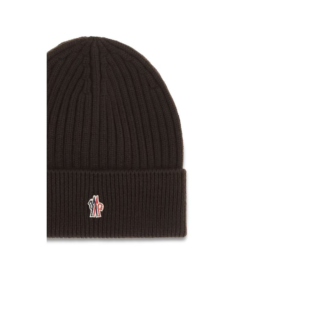 Black ribbed knit beanie with folded cuff and embroidered logo patch