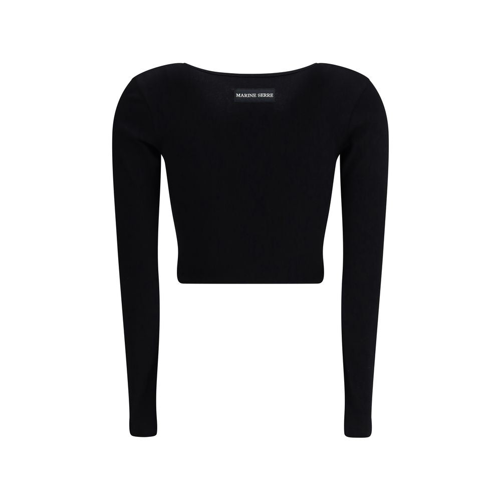 Black long sleeve cropped top with scoop neckline and small circular white logo