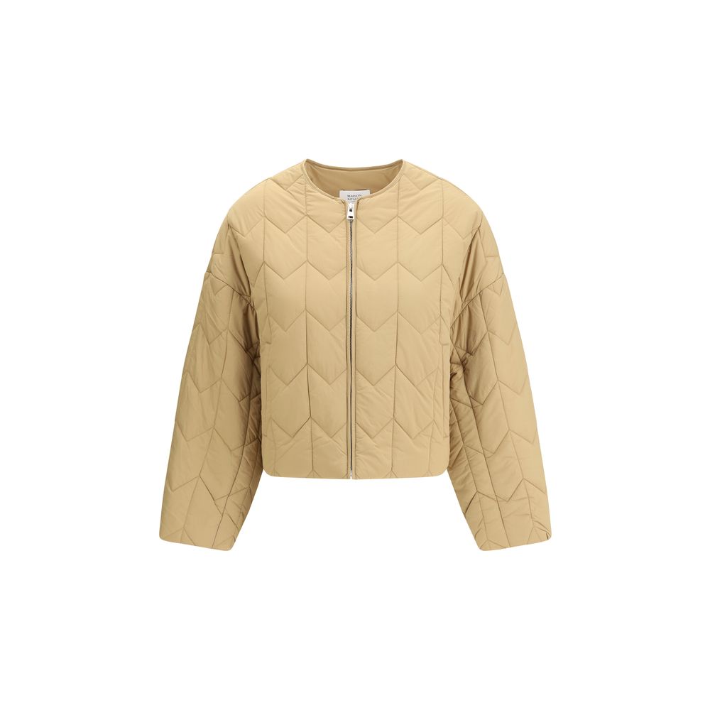 Beige quilted cropped jacket with long sleeves and front zipper on white background