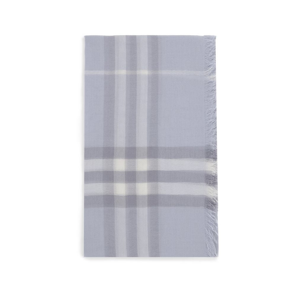 Folded light blue plaid scarf with white and gray stripes and fringed edges