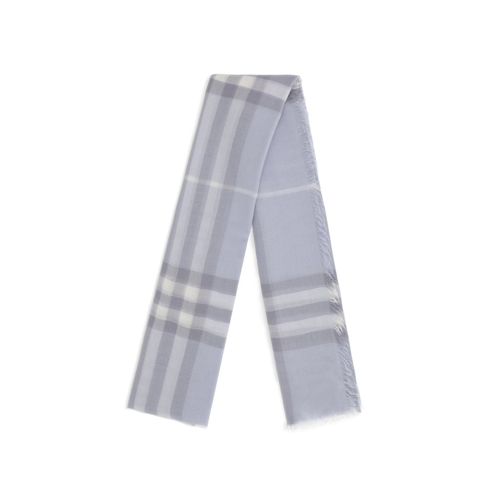 Soft light blue plaid scarf with fringed edges on white background