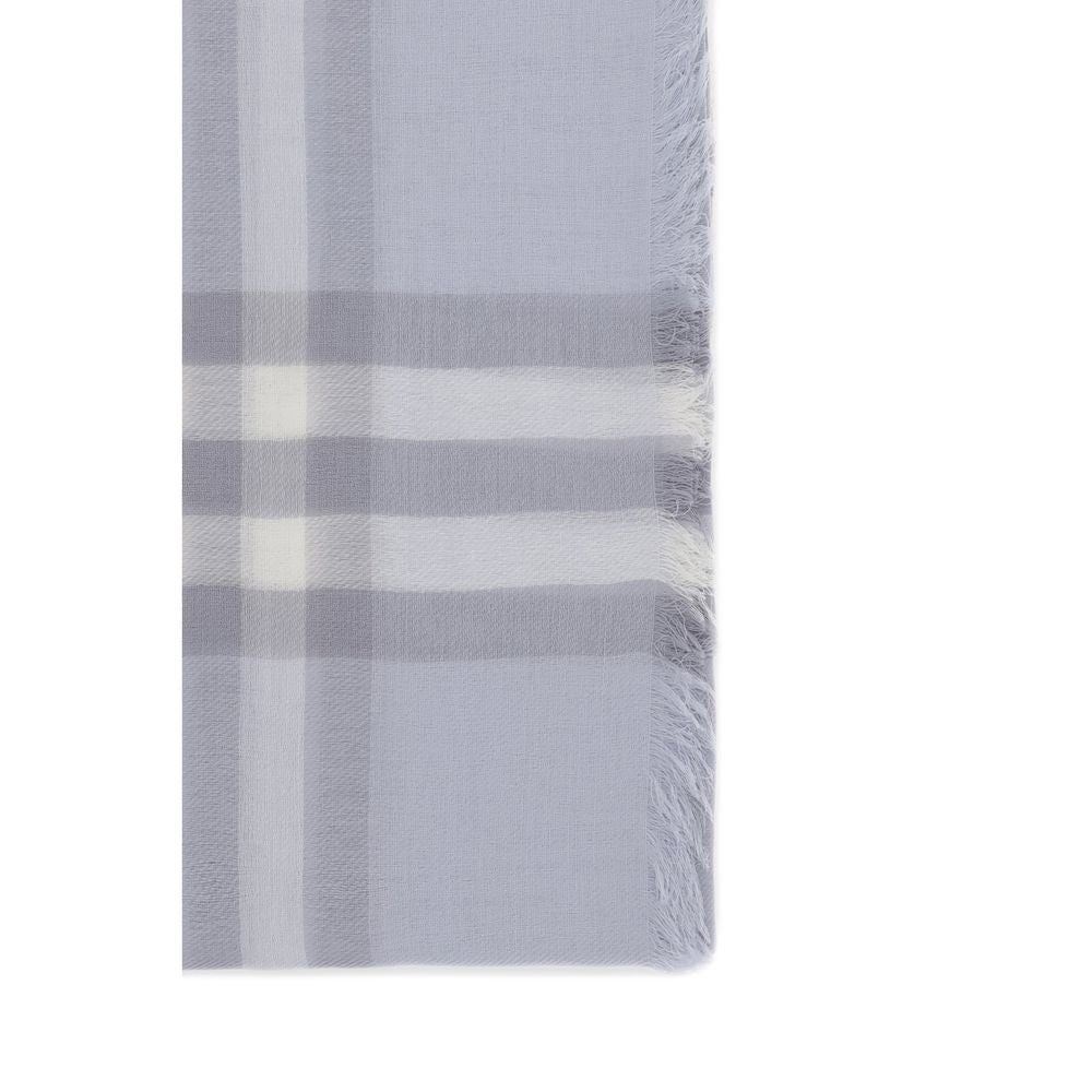 Close-up of soft grey plaid scarf with white stripes and fringed edges