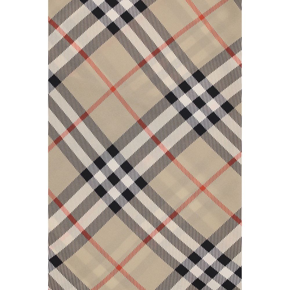 Beige fabric with classic black, white, and red plaid pattern textile design