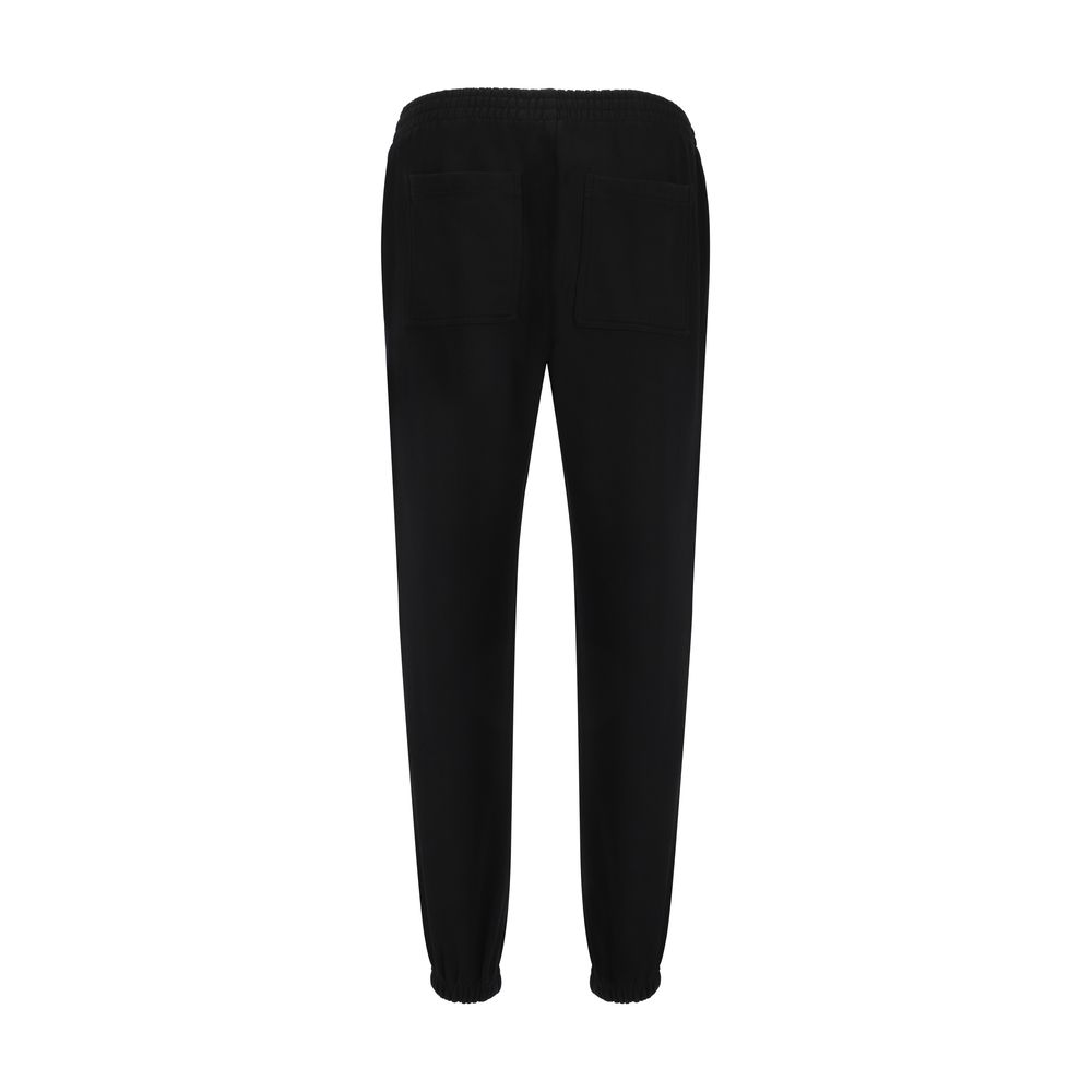 Back view of black jogger pants with elastic waistband and cuffs, featuring two rear pockets