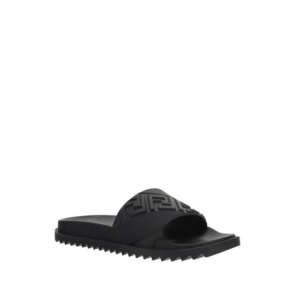 Black slide sandal with zigzag sole and embossed geometric strap design