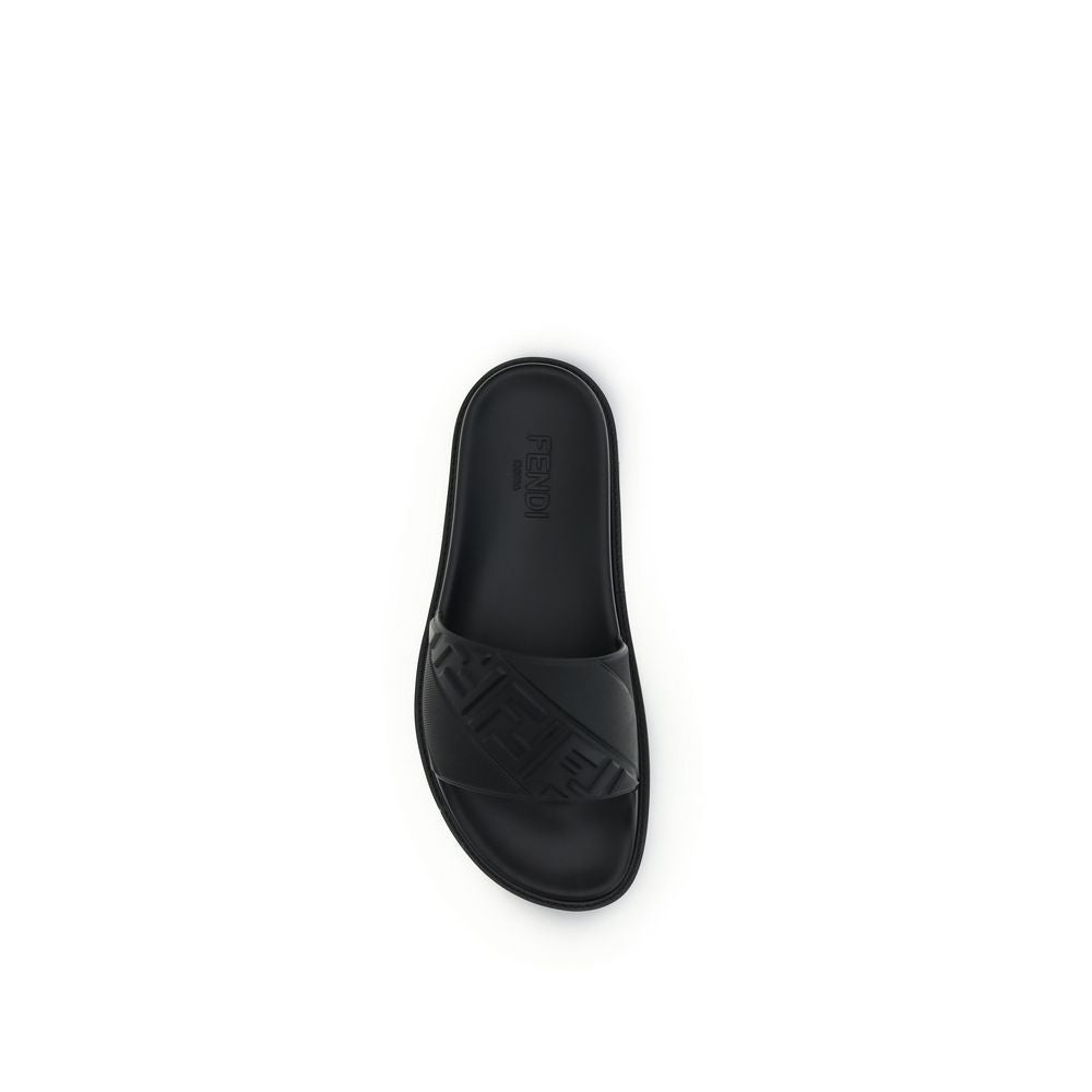 Black Fendi rubber slide sandal with embossed logo strap on white background